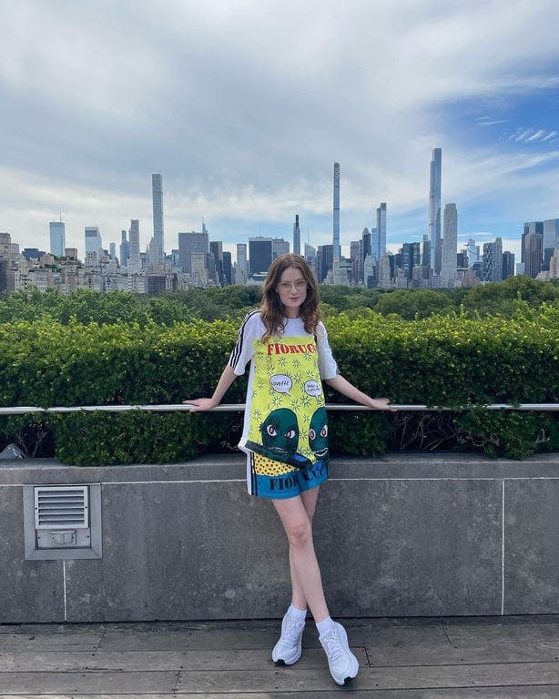 A person standing in front of NYC skyline