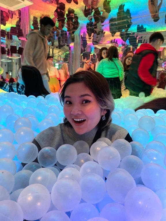 A woman in a ball pit
